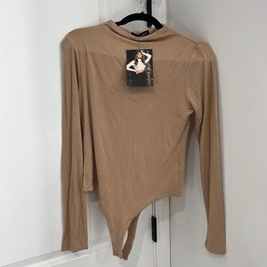 Brand new w/tags. Tan body suit. Size XL
